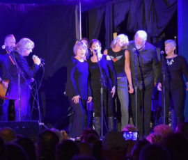 Lou Gramm, lead singer of Foreigner, needed backup singers for a concert on AMI. We practiced with him the night before and had the time of our life singing the next night!